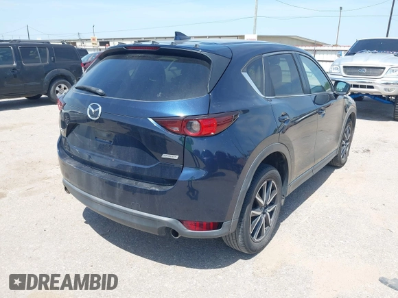 2018 Mazda CX-5 Touring z VIN JM3KFACM7J1410275, wystawiony jako IAAI lot #42248830 z przebiegiem 101 125 mil mil oraz . Historia ofert i sprzedaży dostępna na DreamBid. Obrazek 4.