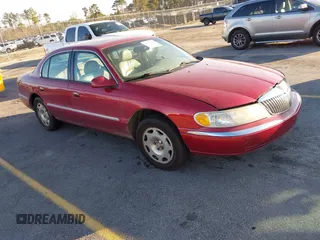 1999 Lincoln Continental with VIN 1LNHM97V8XY633821, listed as a IAAI auction lot 41769620 with 268,617 mi miles. Bid and sale history available at carsss.com. Image 1.