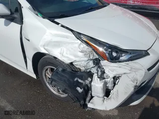 2019 Toyota Prius L Eco with VIN JTDKARFU7K3093038, listed as a IAAI auction lot 41768066 with 124,495 mi miles. Bid and sale history available at carsss.com. Image 6.