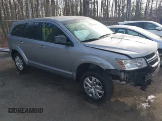 2015 Dodge Journey SE z VIN 3C4PDCAB3FT641675, wystawiony jako IAAI lot #41898611 z przebiegiem 218 121 mil mil oraz . Historia ofert i sprzedaży dostępna na DreamBid. Obrazek 1.