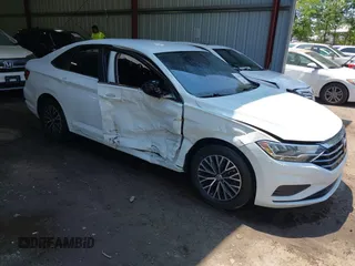2021 Volkswagen Jetta S z VIN 3VWC57BU0MM086014, wystawiony jako IAAI lot #42386251 z przebiegiem 82 397 mil mil oraz . Historia ofert i sprzedaży dostępna na DreamBid. Obrazek 1.