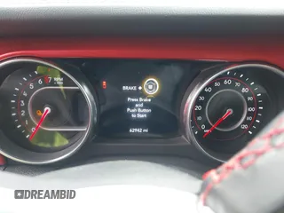 2021 Jeep Gladiator Rubicon z VIN 1C6JJTBG8ML524215, wystawiony jako IAAI lot #41829990 z przebiegiem 62 942 mil mil oraz . Historia ofert i sprzedaży dostępna na DreamBid. Obrazek 7.