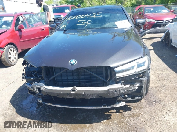 2021 BMW 5 Series 530i xDrive with VIN WBA13BJ0XMWX00677, listed as a IAAI auction lot 42100435 with 66,140 mi miles and . Bid and sale history available at DreamBid. Image 6.