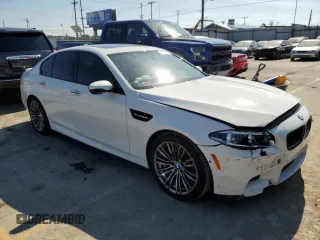 2014 BMW M5 with VIN WBSFV9C57ED097570, listed as a Copart auction lot 88571785 with 100,391 mi miles and Salvage Title. Bid and sale history available at carsss.com. Image 4.