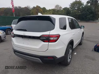 2023 Honda Pilot EX-L with VIN 5FNYG1H58PB016138, listed as a IAAI auction lot 40591717 with 10,068 mi miles and . Bid and sale history available at DreamBid. Image 4.