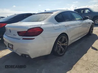 2016 BMW M6 z VIN WBS6E9C55GGF92676, wystawiony jako Copart lot #77663924 z przebiegiem 36 548 mil mil oraz Szkoda całkowita • Salvage title. Historia ofert i sprzedaży dostępna na DreamBid. Obrazek 3.