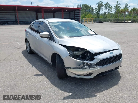 2018 Ford Focus SE z VIN 1FADP3FE9JL241661, wystawiony jako IAAI lot #42103513 z przebiegiem 117 003 mil mil oraz . Historia ofert i sprzedaży dostępna na DreamBid. Obrazek 6.