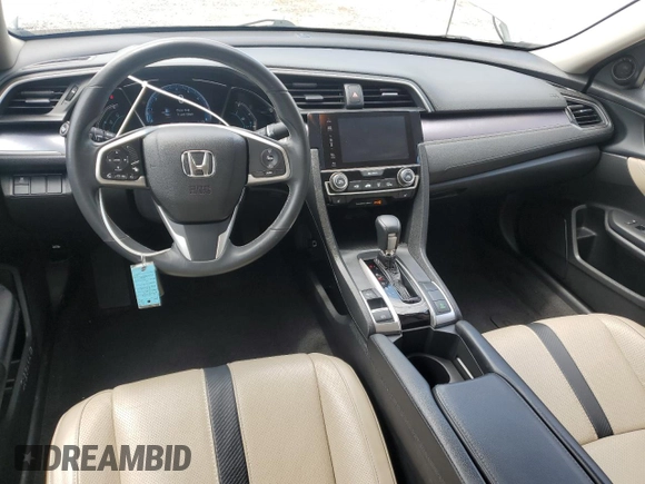 2017 Honda Civic EX-L z VIN 19XFC1F74HE014241, wystawiony jako Copart lot #59005745 z przebiegiem 55 629 mil mil oraz Czysty tytuł • Clean title. Historia ofert i sprzedaży dostępna na DreamBid. Obrazek 8.