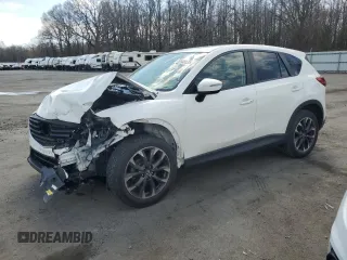 2016 Mazda CX-5 Grand Touring z VIN JM3KE2DY9G0645141, wystawiony jako Copart lot #50989635 z przebiegiem 123 898 mil mil oraz Szkoda całkowita • Salvage title. Historia ofert i sprzedaży dostępna na DreamBid. Obrazek 1.