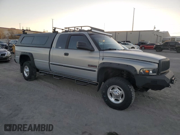 2000 Dodge 2500 z VIN 1B7KF2369YJ144753, wystawiony jako Copart lot #80801414 z przebiegiem 173 413 mil mil oraz Szkoda całkowita • Salvage title. Historia ofert i sprzedaży dostępna na DreamBid. Obrazek 4.