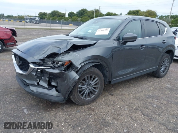 2021 Mazda CX-5 Touring with VIN JM3KFACM1M0461510, listed as a IAAI auction lot 41660439 with 30,352 mi miles. Bid and sale history available at carsss.com. Image 17.