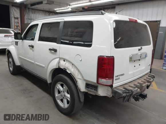 2007 Dodge Nitro SLT with VIN 1D8GU58K97W583408, listed as a IAAI auction lot 41653696 with 124,449 mi miles. Bid and sale history available at carsss.com. Image 3.