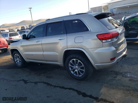 2014 Jeep Grand Cherokee Overland with VIN 1C4RJFCM2EC556953, listed as a Copart auction lot 73046974 with 106,889 mi miles and Salvage Title. Bid and sale history available at carsss.com. Image 2.
