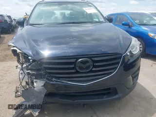 2016 Mazda CX-5 Sport z VIN JM3KE2BY0G0633611, wystawiony jako IAAI lot #42390654 z przebiegiem Nie podano mil oraz . Historia ofert i sprzedaży dostępna na DreamBid. Obrazek 6.