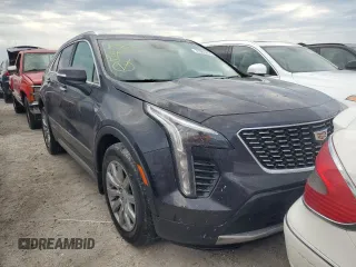 2022 Cadillac XT4 FWD Premium Luxury z VIN 1GYFZCR44NF166169, wystawiony jako Copart lot #77981414 z przebiegiem 9 734 mil mil oraz Nie do naprawy • Non repairable. Historia ofert i sprzedaży dostępna na DreamBid. Obrazek 4.
