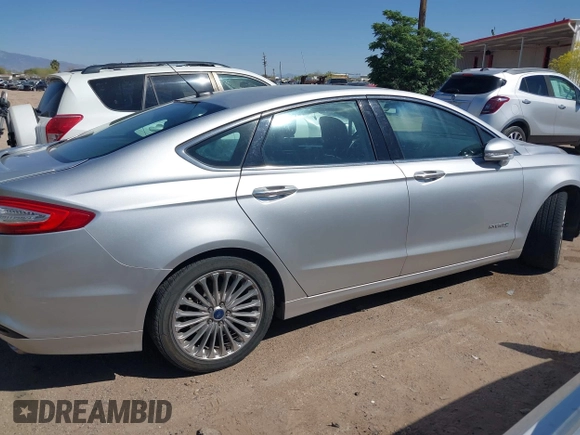 2014 Ford Fusion Titanium Hybrid with VIN 3FA6P0RUXER103516, listed as a IAAI auction lot 42004602 with 128,287 mi miles and . Bid and sale history available at carsss.com. Image 13.