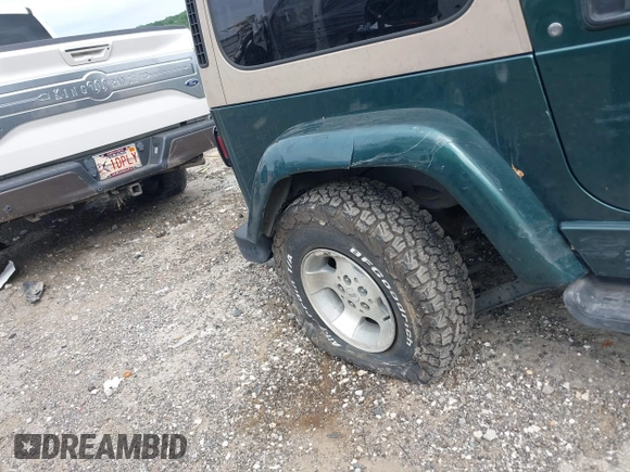 1999 Jeep Wrangler Sahara with VIN 1J4FY49S5XP482037, listed as a IAAI auction lot 42341723 with 161,081 mi miles and . Bid and sale history available at DreamBid. Image 6.