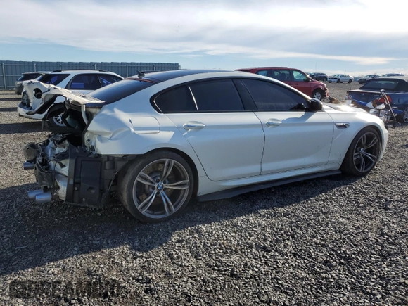 2017 BMW M6 with VIN WBS6E9C56HG437410, listed as a Copart auction lot 80217694 with 68,335 mi miles and Salvage title. Bid and sale history available at DreamBid. Image 3.