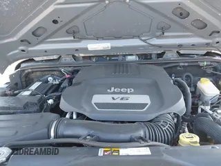 2015 Jeep Wrangler Sport with VIN 1C4AJWAG0FL591213, listed as a IAAI auction lot 41893306 with 107,807 mi miles and . Bid and sale history available at DreamBid. Image 10.