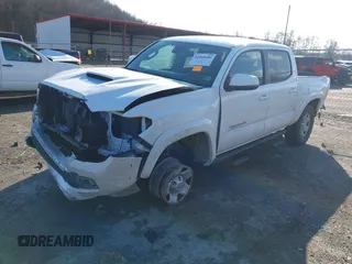 2023 Toyota Tacoma 4WD SR with VIN 3TMCZ5AN1PM538367, listed as a IAAI auction lot 41468684 with 28,879 mi miles. Bid and sale history available at carsss.com. Image 2.