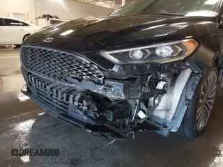 2017 Ford Fusion Titanium with VIN 3FA6P0SUXHR208653, listed as a IAAI auction lot 41312067 with 62,601 mi miles and . Bid and sale history available at DreamBid. Image 6.