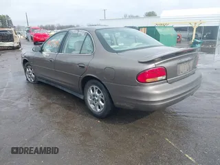 2000 Oldsmobile Intrigue GLS z VIN 1G3WX52H9YF131166, wystawiony jako IAAI lot #41527895 z przebiegiem 104 534 mil mil oraz . Historia ofert i sprzedaży dostępna na DreamBid. Obrazek 3.