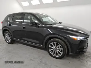 2021 Mazda CX-5 Grand Touring with VIN JM3KFBDM6M0487606, listed as a Copart auction lot 45399655 with 25,241 mi miles and Clean Title. Bid and sale history available at DreamBid. Image 4.