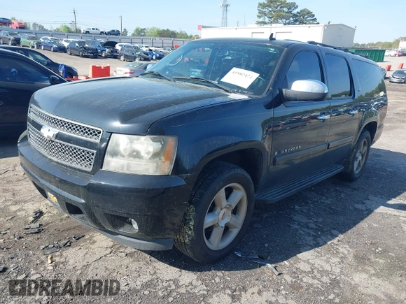2007 Chevrolet Suburban LT with VIN 1GNFC16077R409950, listed as a IAAI auction lot 41882474 with 266,195 mi miles and . Bid and sale history available at DreamBid. Image 2.