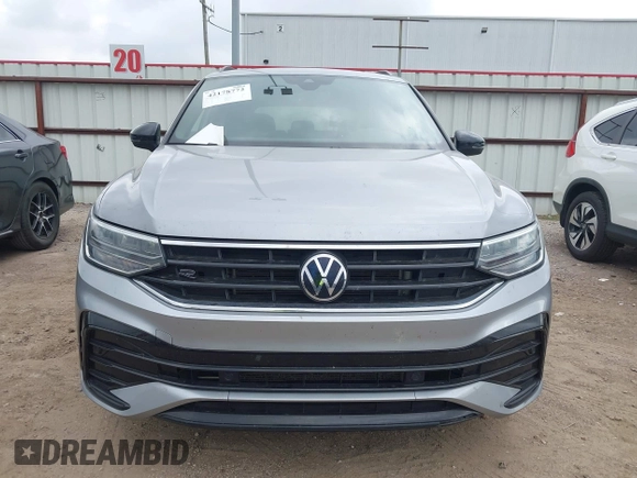 2022 Volkswagen Tiguan SE R-Line Black with VIN 3VVCB7AXXNM165748, listed as a IAAI auction lot 42178772 with 64,007 mi miles and . Bid and sale history available at DreamBid. Image 12.