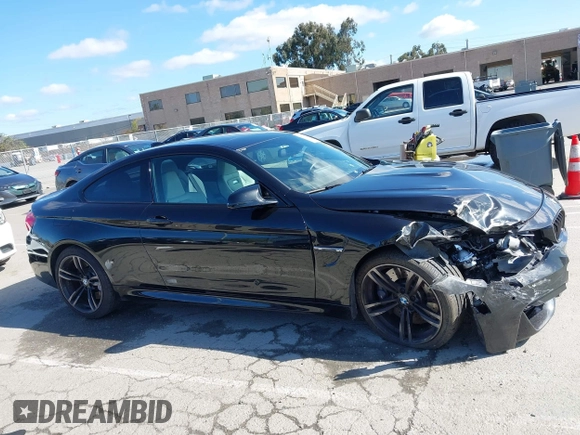 2015 BMW M4 with VIN WBS3R9C58FK334247, listed as a IAAI auction lot 41940211 with 125,881 mi miles. Bid and sale history available at carsss.com. Image 12.