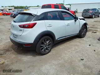 2017 Mazda CX-3 Grand Touring with VIN JM1DKFD78H0160564, listed as a IAAI auction lot 39236942 with 50,921 mi miles. Bid and sale history available at carsss.com. Image 4.