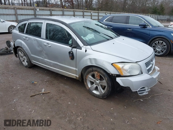 2010 Dodge Caliber SXT z VIN 1B3CB4HA1AD663892, wystawiony jako IAAI lot #41535071 z przebiegiem 186 900 mil mil oraz . Historia ofert i sprzedaży dostępna na DreamBid. Obrazek 1.