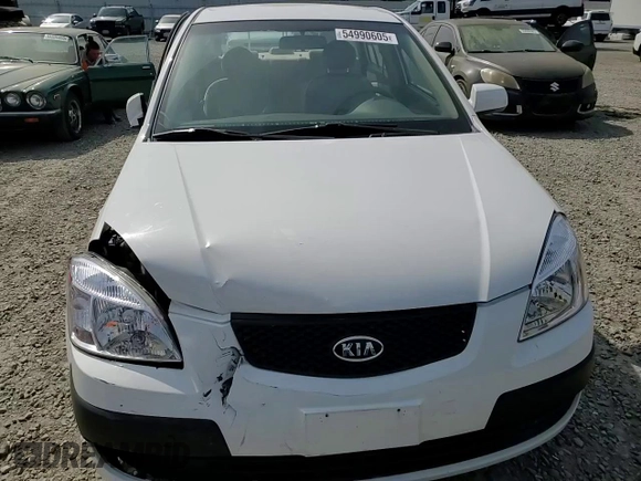 2009 Kia Rio LX with VIN KNADE223896456292, listed as a Copart auction lot 54990605 with 61,220 mi miles and Salvage Title. Bid and sale history available at DreamBid. Image 13.