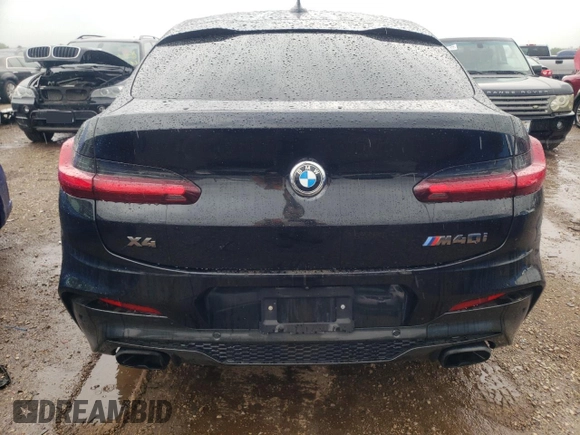 2021 BMW X4 M40i with VIN 5UX2V5C00M9H95699, listed as a Copart auction lot 63564433 with 33,500 mi miles and Salvage title. Bid and sale history available at DreamBid. Image 6.