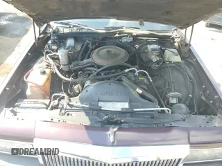 1987 Chevrolet Caprice z VIN 1G1BU51H7H9156079, wystawiony jako Copart lot #60443124 z przebiegiem 44 452 mil mil oraz Szkoda całkowita • Salvage title. Historia ofert i sprzedaży dostępna na DreamBid. Obrazek 11.