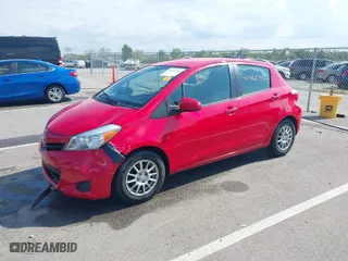 2014 Toyota Yaris L with VIN JTDKTUD36ED592371, listed as a IAAI auction lot 40461730 with 164,423 mi miles. Bid and sale history available at carsss.com. Image 2.