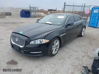 2015 Jaguar XJ with VIN SAJWJ2GD0F8V85914, listed as a IAAI auction lot 41615059 with 115,462 mi miles. Bid and sale history available at carsss.com. Image 2.
