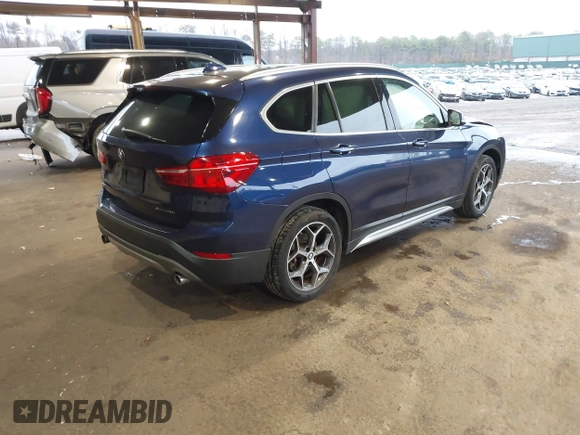 2019 BMW X1 xDrive28i with VIN WBXHT3C55K5L37338, listed as a IAAI auction lot 41934461 with 87,913 mi miles. Bid and sale history available at carsss.com. Image 4.
