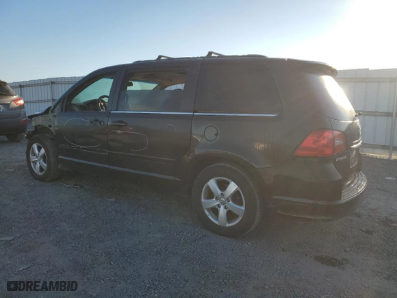 2011 Volkswagen Routan SE with VIN 2V4RW3DG8BR670831, listed as a Copart auction lot 76255734 with 136,665 mi miles and Salvage Title. Bid and sale history available at carsss.com. Image 2.