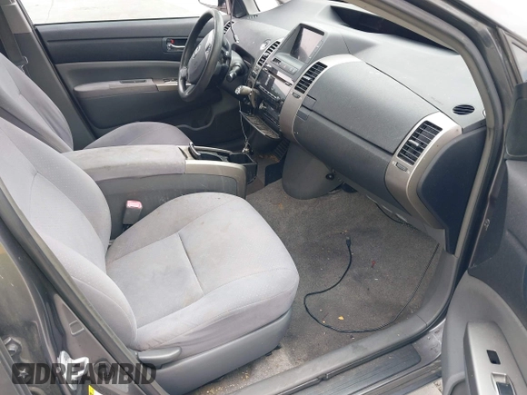 2007 Toyota Prius z VIN JTDKB20U573236900, wystawiony jako IAAI lot #42375325 z przebiegiem Nie podano mil oraz . Historia ofert i sprzedaży dostępna na DreamBid. Obrazek 5.
