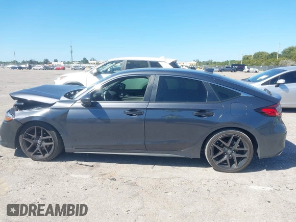 2023 Honda Civic Sport Touring z VIN 19XFL1H80PE017819, wystawiony jako IAAI lot #41833813 z przebiegiem 26 279 mil mil oraz . Historia ofert i sprzedaży dostępna na DreamBid. Obrazek 14.