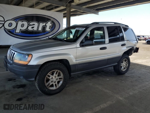 2003 Jeep Grand Cherokee Laredo with VIN 1J4GW48S23C617830, listed as a Copart auction lot 57481565 with 122,745 mi miles and Salvage title. Bid and sale history available at DreamBid. Image 1.