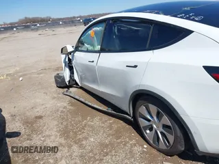 2021 Tesla Model Y Long Range with VIN 5YJYGDEE0MF106255, listed as a IAAI auction lot 41736610 with Not Provided miles. Bid and sale history available at carsss.com. Image 12.