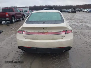 2015 Lincoln MKZ z VIN 3LN6L2J96FR618325, wystawiony jako IAAI lot #41046851 z przebiegiem Nie podano mil oraz . Historia ofert i sprzedaży dostępna na DreamBid. Obrazek 16.