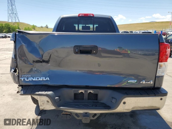 2010 Toyota Tundra with VIN 5TFUW5F14AX148898, listed as a Copart auction lot 63316765 with 79,983 mi miles and Salvage title. Bid and sale history available at DreamBid. Image 6.