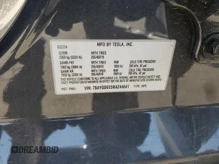 2024 Tesla Model Y Long Range z VIN 7SAYGDEE5RA244641, wystawiony jako Copart lot #51864845 z przebiegiem 23 096 mil mil oraz Szkoda całkowita • Salvage title. Historia ofert i sprzedaży dostępna na DreamBid. Obrazek 16.