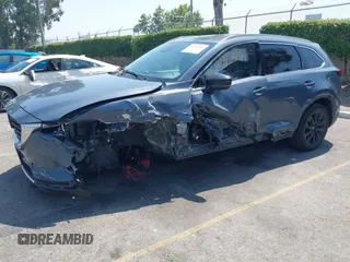 2022 Mazda CX-9 Grand Touring with VIN JM3TCBDY1N0611766, listed as a IAAI auction lot 42452059 with 60,755 mi miles and . Bid and sale history available at DreamBid. Image 2.