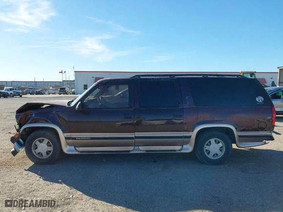 1997 GMC Suburban with VIN 1GKEC16RXVJ703491, listed as a IAAI auction lot 41219414 with NaN miles. Bid and sale history available at carsss.com. Image 14.