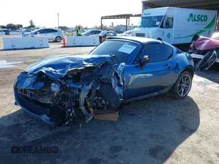 2020 Mazda MX-5 Miata Grand Touring z VIN JM1NDAM75L0412507, wystawiony jako IAAI lot #41573544 z przebiegiem Nie podano mil oraz . Historia ofert i sprzedaży dostępna na DreamBid. Obrazek 17.