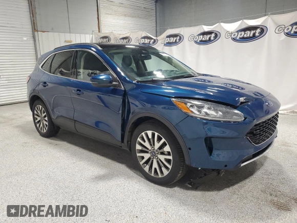 2020 Ford Escape Titanium z VIN 1FMCU9J98LUA93393, wystawiony jako Copart lot #65366925 z przebiegiem 74 750 mil mil oraz Czysty tytuł • Clean title. Historia ofert i sprzedaży dostępna na DreamBid. Obrazek 4.